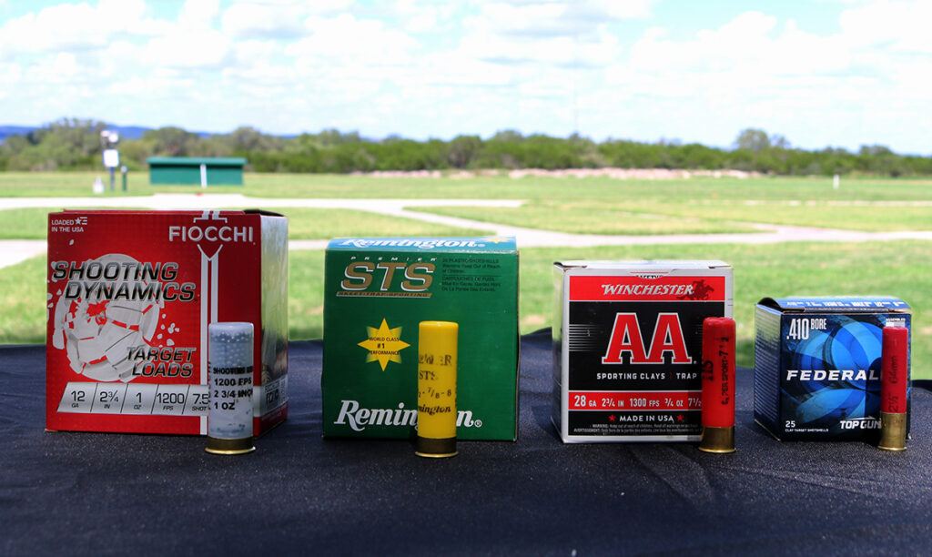 Shotgun Shells - Shotshell Boxes - gaiges 12, 20, 28 and .410 bore shown on a skeet field