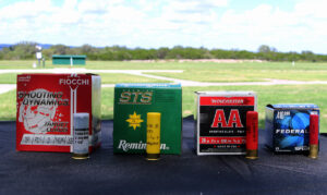 Shotgun Shells - Shotshell Boxes - gaiges 12, 20, 28 and .410 bore shown on a skeet field