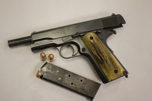 A Colt 1911 in .45-caliber shown with its slide locked open and the magazine out of the pistol’s grip. You can shoot .22 LR in this gun with a separate conversion kit. Photo courtesy Phil & Suzie Massaro.