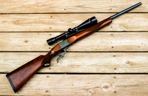 The Ruger No. 1 typically comes with blued metal and a two-piece wood stock.