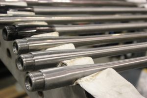 Barrel blanks being prepared for rifling at the factory.