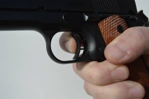 Trigger finger placement is very important no matter what shooting discipline you are engaged in. This finger position will likely cause the pressure on the trigger to be applied to the left side, and not straight to the rear as it should be.