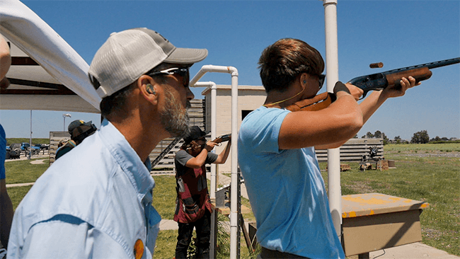 Doug Koenig helping new shooter
