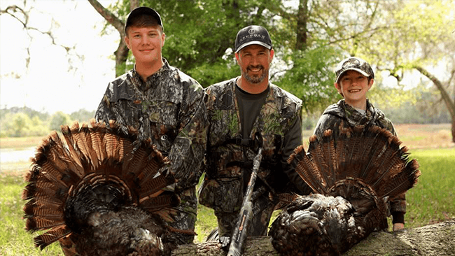 Doug Koenig hunting with Sons