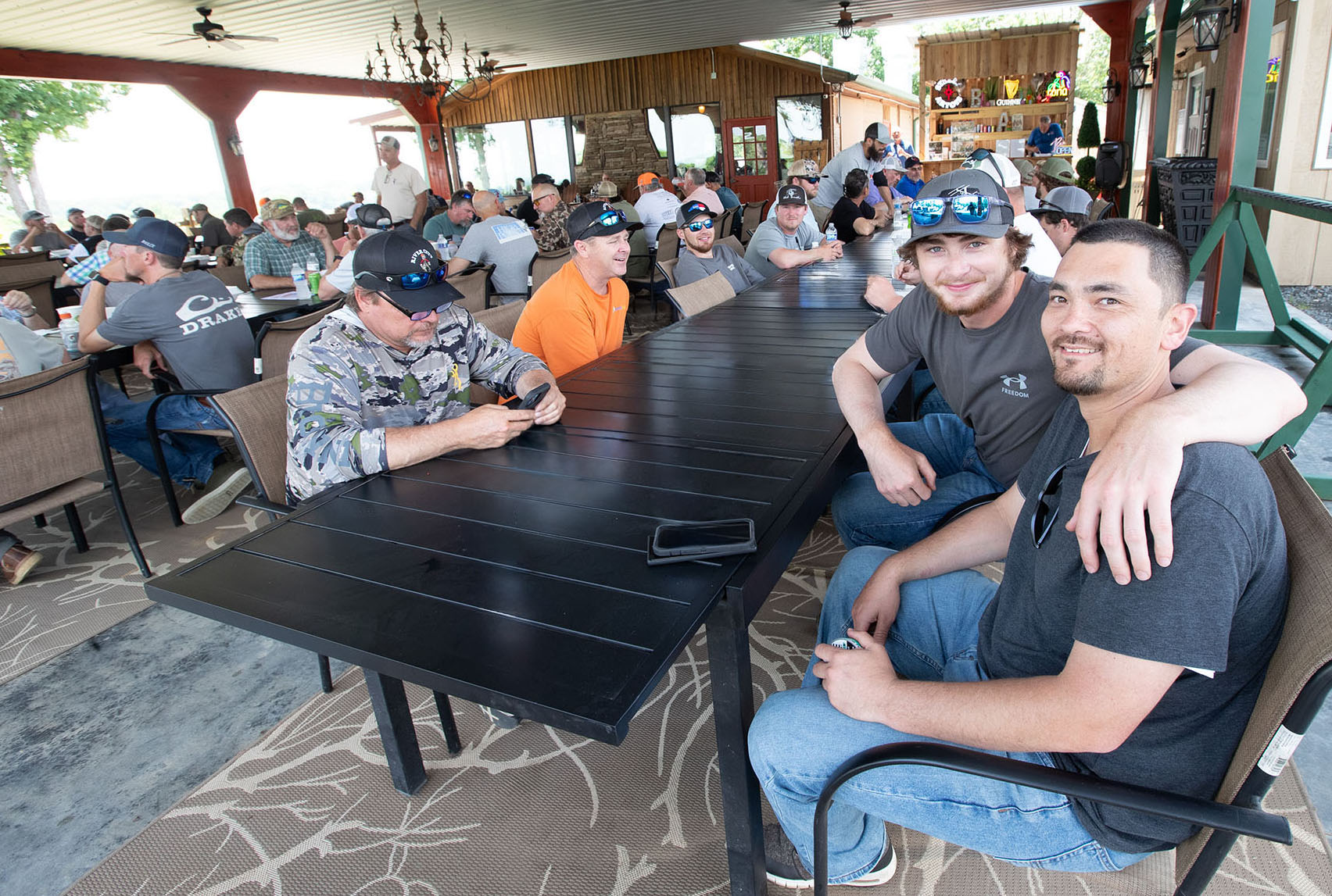 A group of range guests seated at a table.