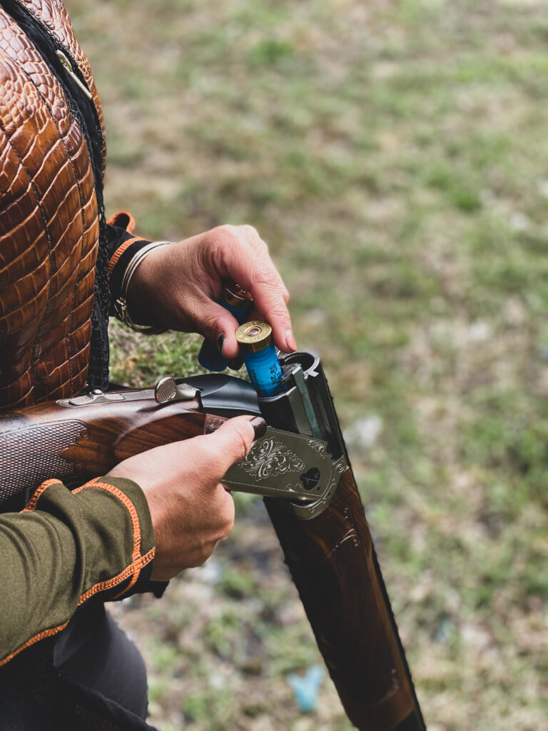 Woman loading Krieghoff 12 gauge Victoria